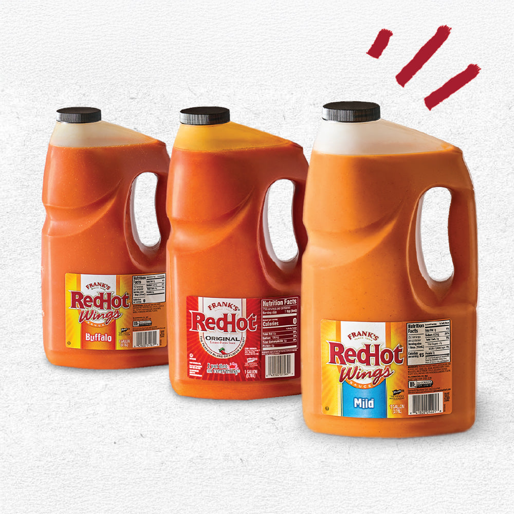 Three bottles of Frank's RedHot hot sauce on a white background