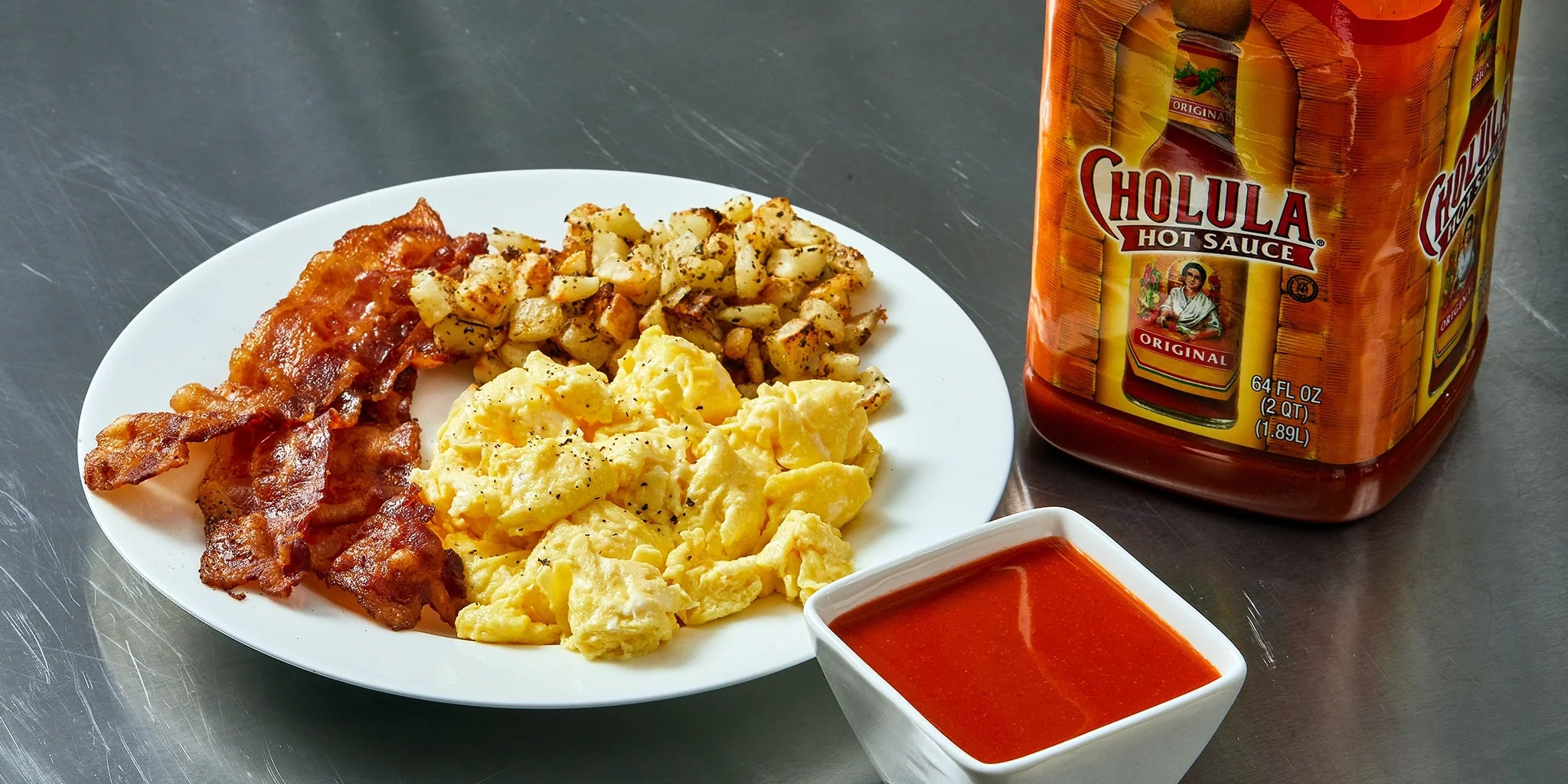 cholula breakfast scrambled eggs with bacons and hashbrowns