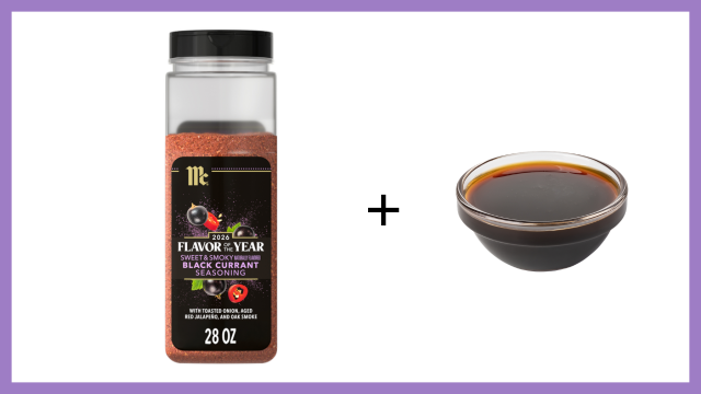 Bottle of black currant extract with a small bowl of the extract on a white background